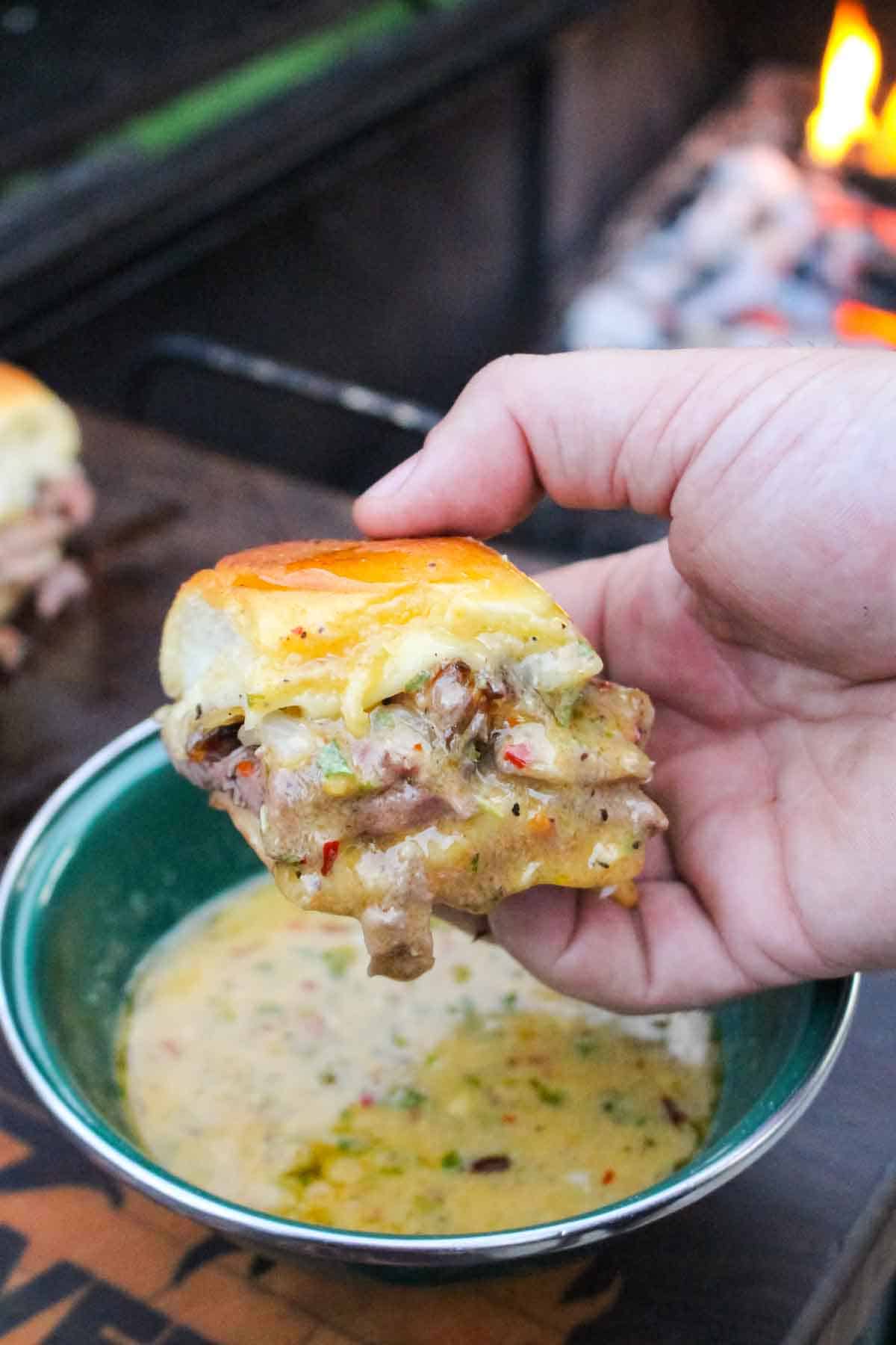 A Cowboy Butter Slider is dipped in the savory and spicy butter. 