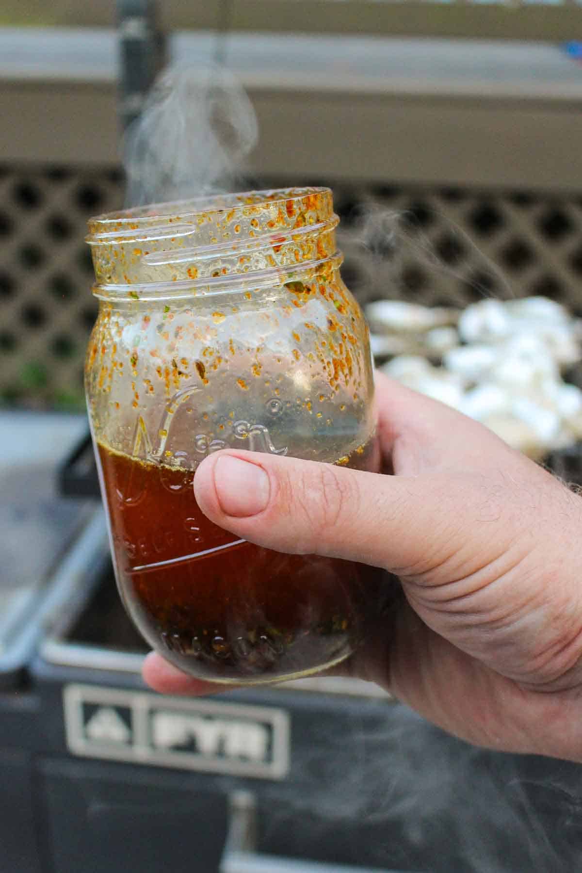 Smoke rising from the hot honey butter in a mason jar.