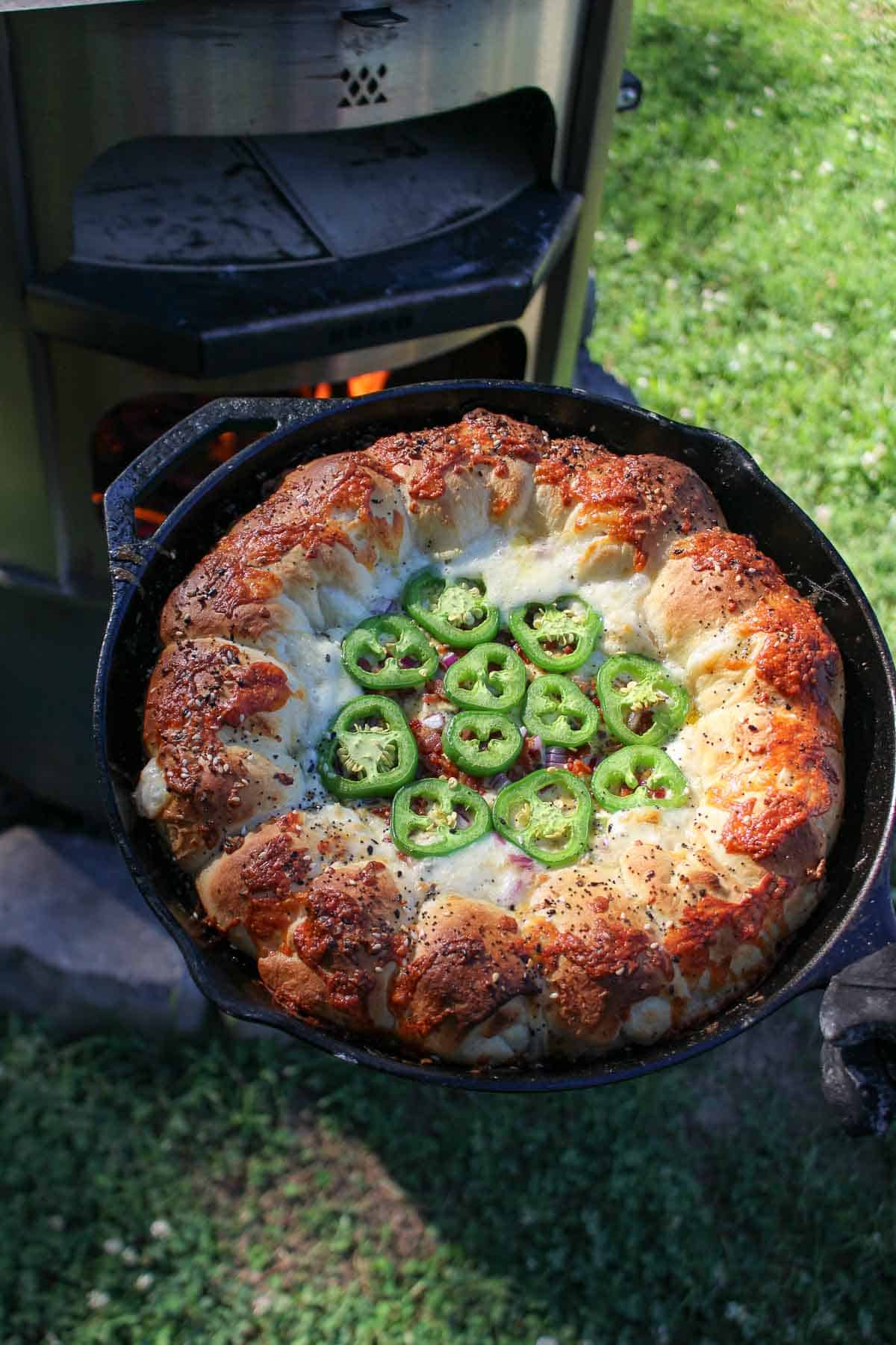 An overhead shot of the jalapeño popper dip as its pulled from the fire oven. 