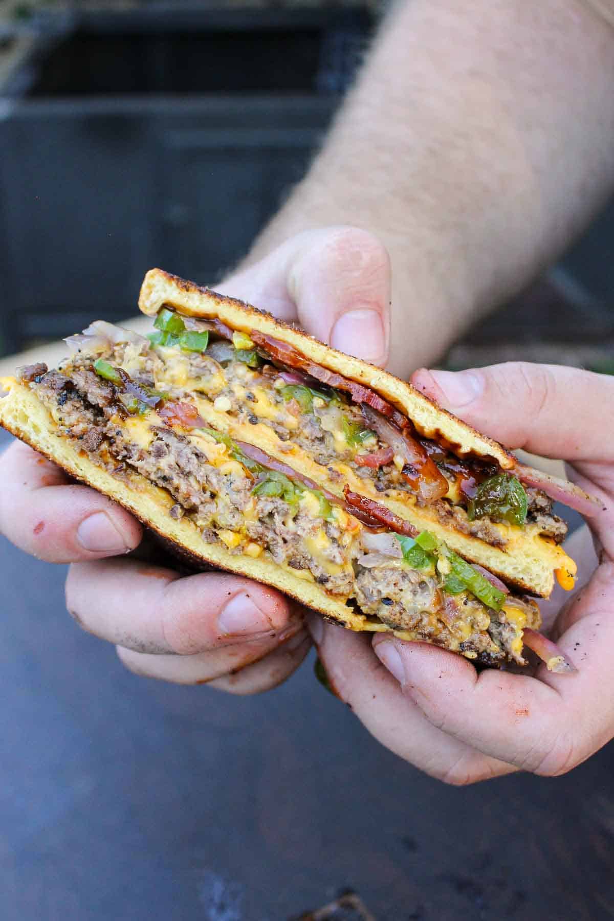 The patty melt is sliced showing off all the layers of flavor. 