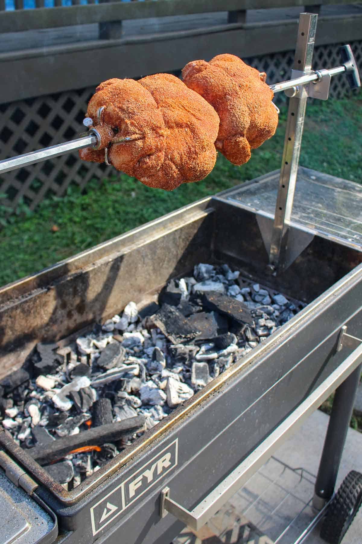 The chicken rotates on the FYR Grill. 