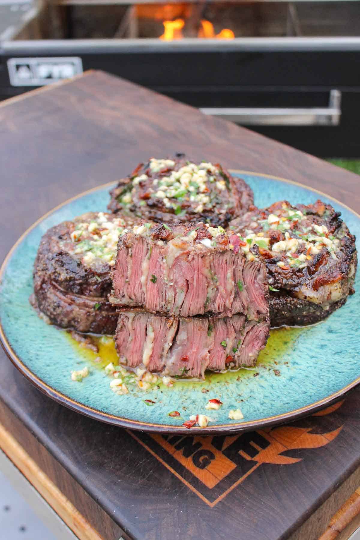 Steak Pinwheels with Cowboy Butter plated and ready to eat. 