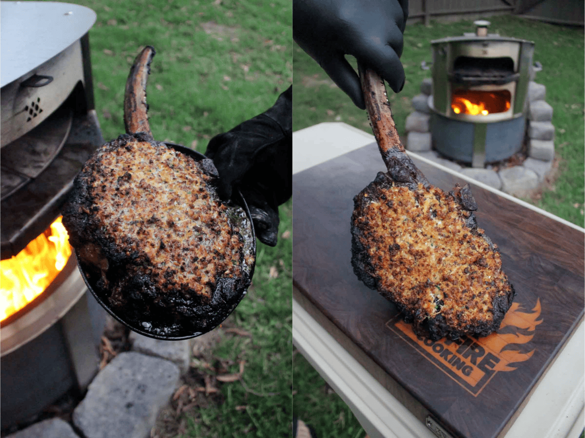 Broiling the Spanish garlic crusted tomahawk steak in the Breeo pizza oven, with a hand holding the long rib bone on the steak