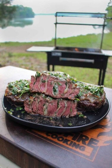 The final result is steak perfection, cut in half with a sharp knife and presented on a platter.