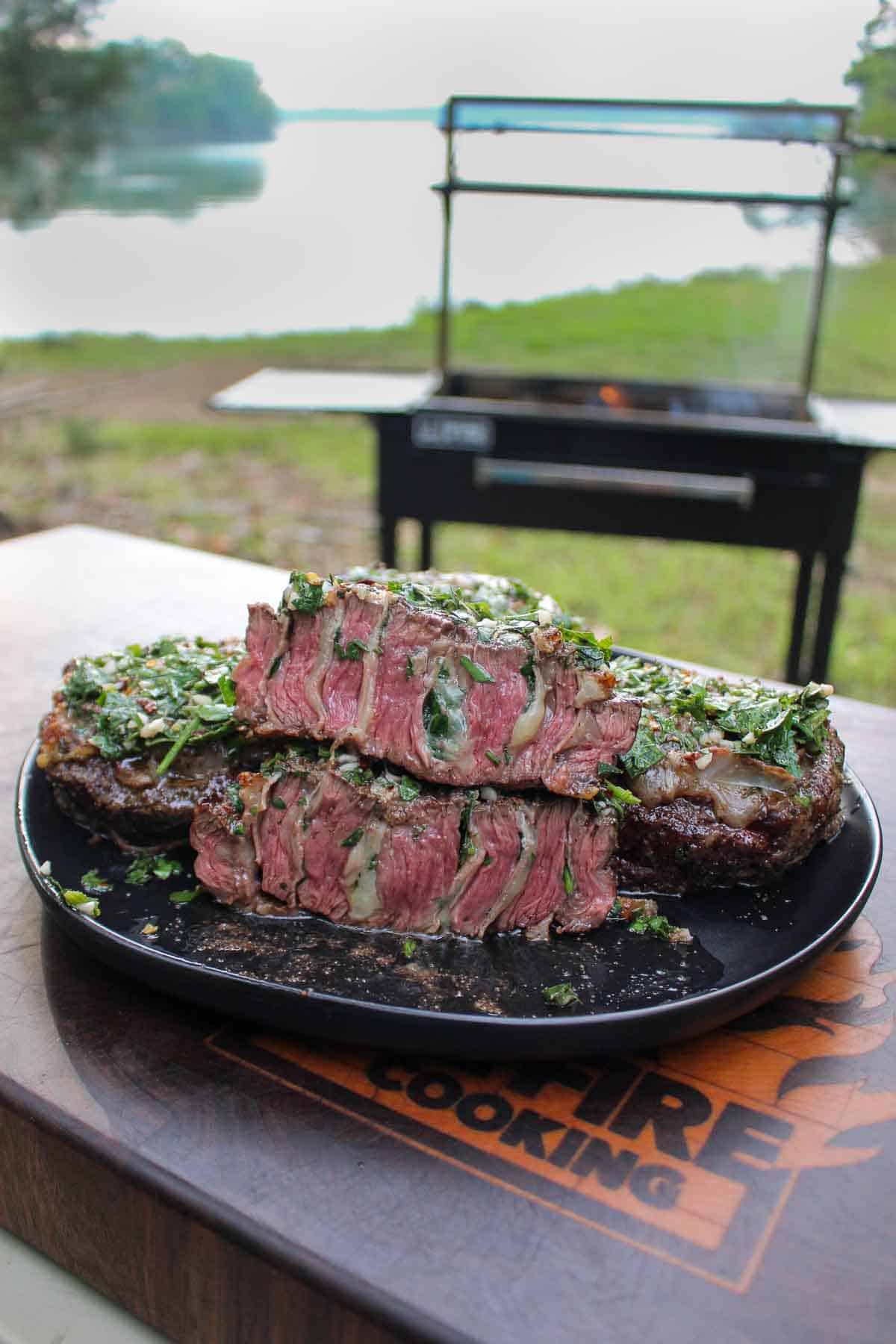 The final result is steak perfection, cut in half with a sharp knife and presented on a platter. 