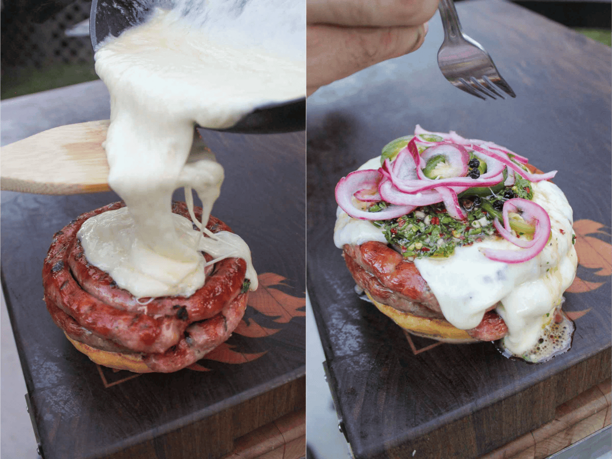 A heaping amount of melted mozzarella cheese is poured over the Choripan Burger during the assembly process.