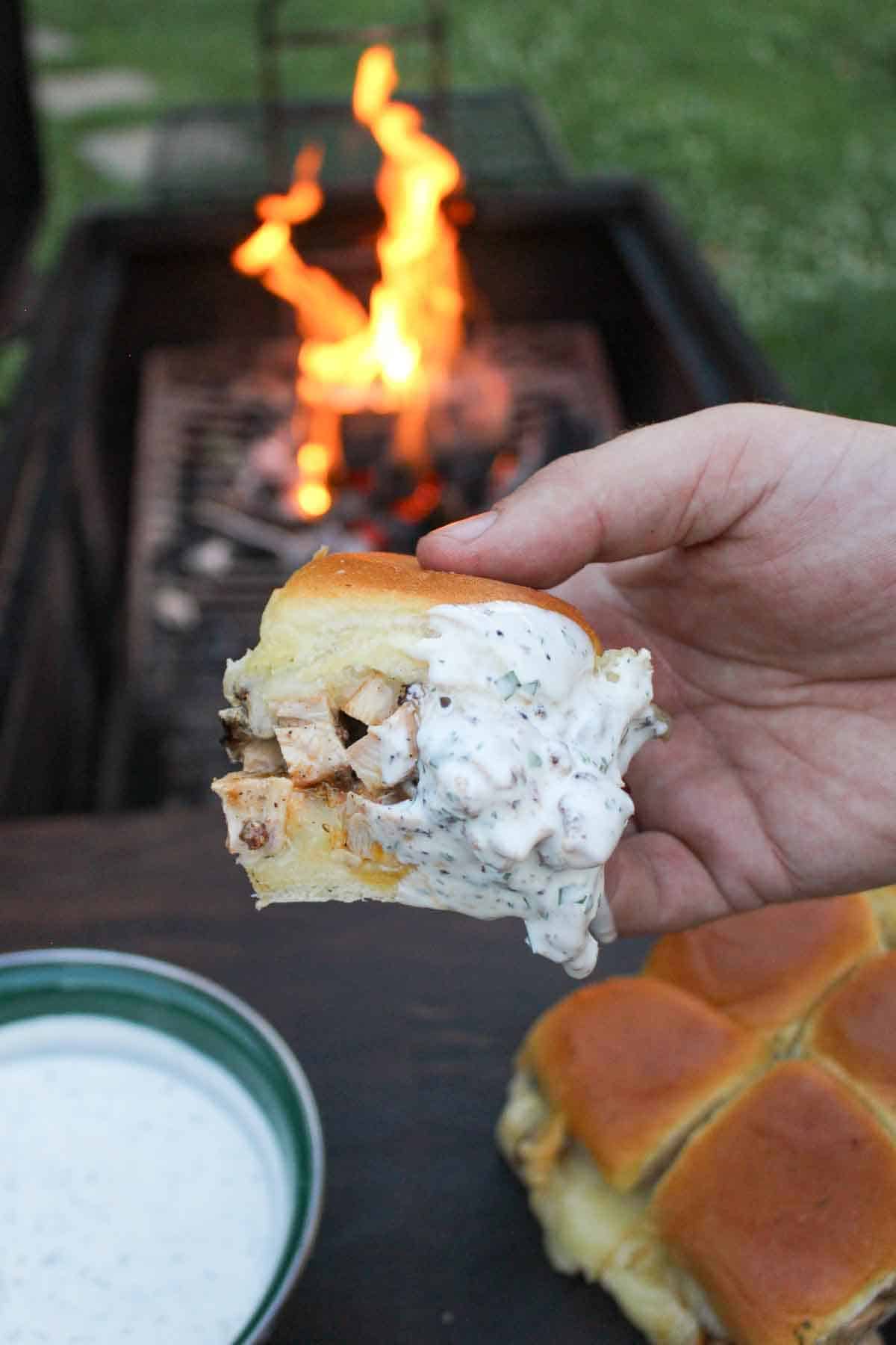 A dipped chicken bacon ranch slider is the perfect tailgate recipe.