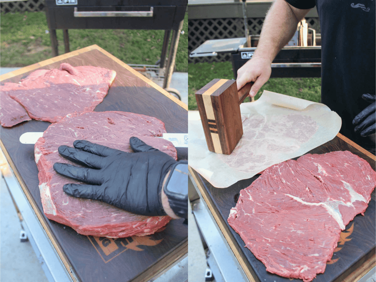 A gloved hand holding slices of top sirloin, and a hand with a mallet pounding the sirloin thin under a piece of parchment paper