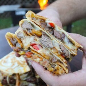 The Steak Fajita Quesadilla is cut in half so that Derek can show off the delicious ingredients: steak, veggies, and lots of cheese.