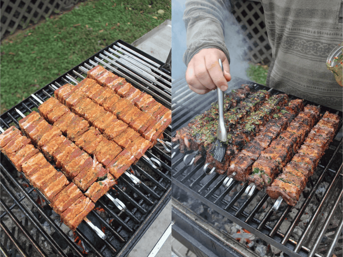 The steak and bacon skewers are fully assembled on the metal skewers and sizzling over a medium-high heat grill.