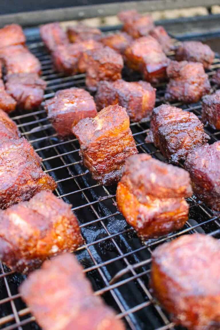 Pork Belly Burnt Ends smoking on a wire rack in the Oklahoma Joe.