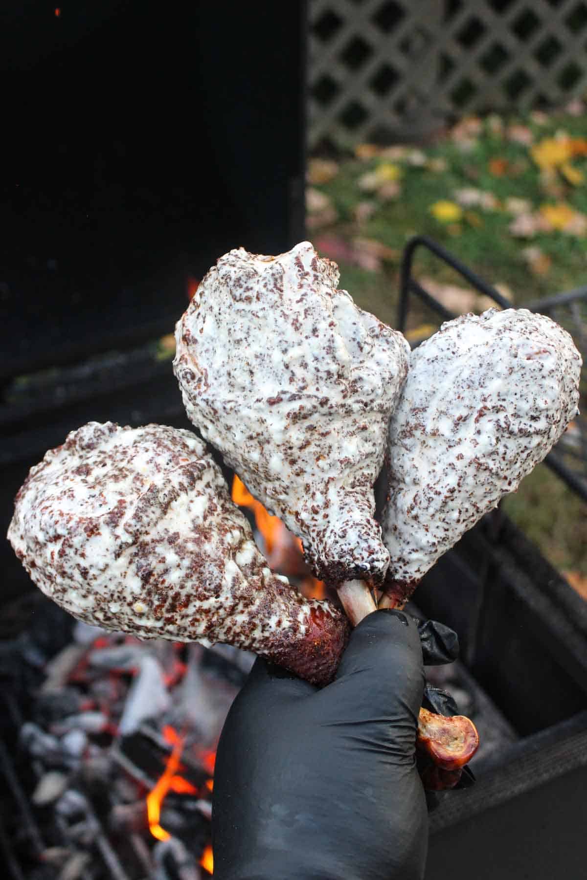 Three beer brined turkey legs dipped in Alabama white sauce