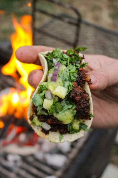 A close up shot of an al pastor taco.