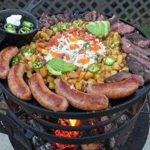 Huevos rancheros, made up of fried eggs, potatoes, chorizo sausage, skirt steak, sliced avocados, jalapeño slices and sour cream