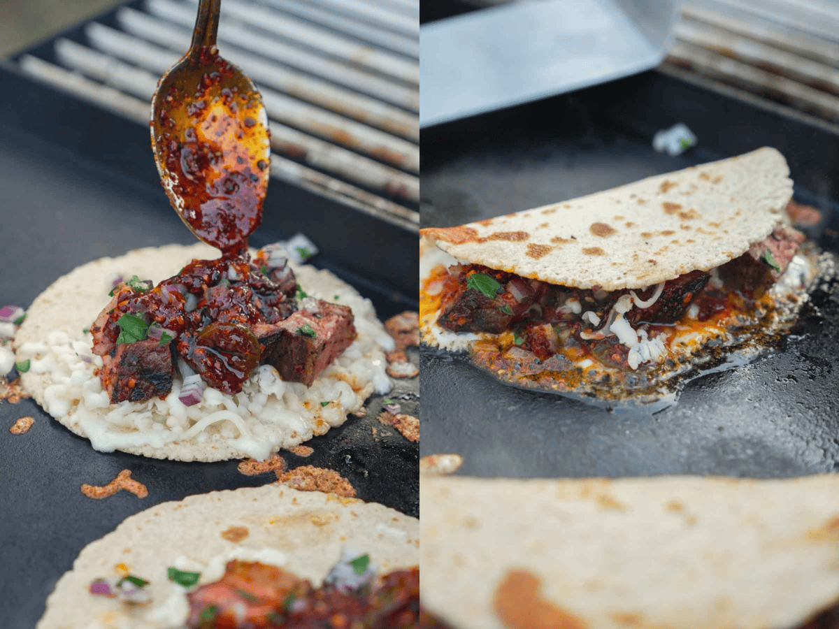 The tacos are assembled and the chili oil is drizzled over the perfectly grilled steak.