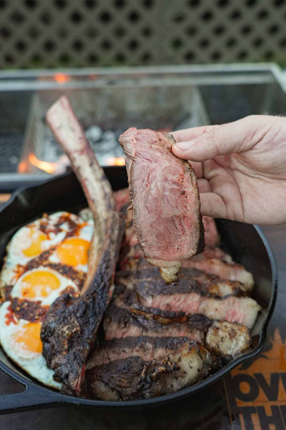 The Triple Seared Steak is sliced with a sharp knife. It's nice and juicy inside and crusty on the outside.