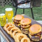 Onion Rings sitting with burgers.