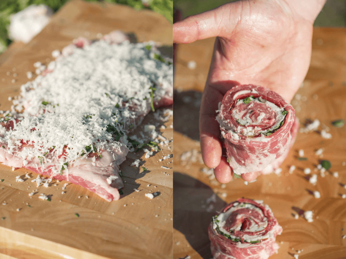 Layering pinwheel ingredients into the secreto steak and rolling the pork up