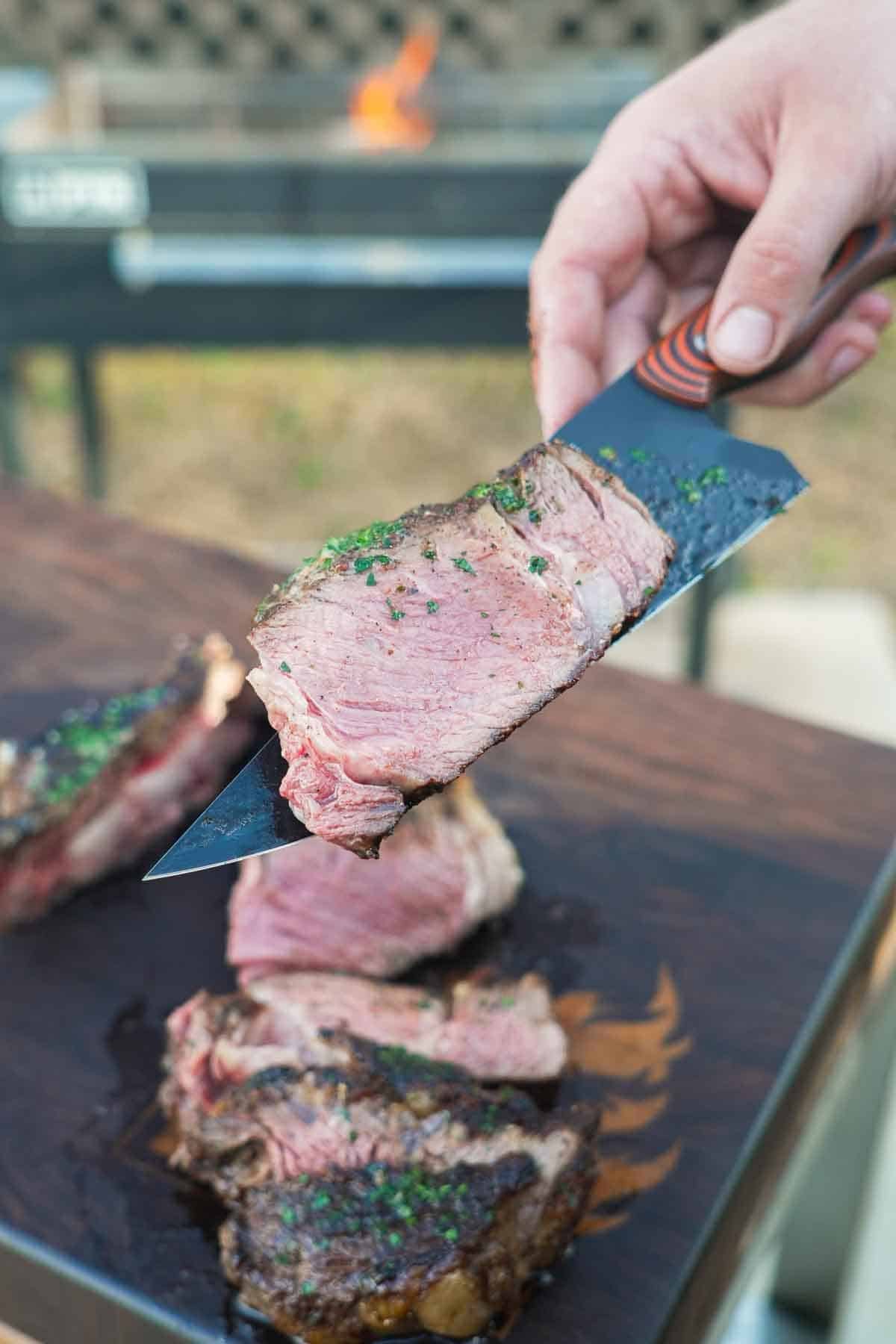 A thinly sliced slice of steak makes for the perfect bite after all that good cooking over the fire style.