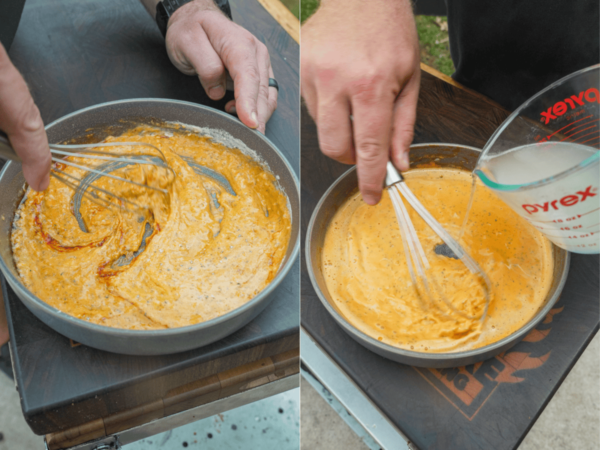 A hand holding a whisk to mix together sauce ingredients for surf and turf ramen in a bowl