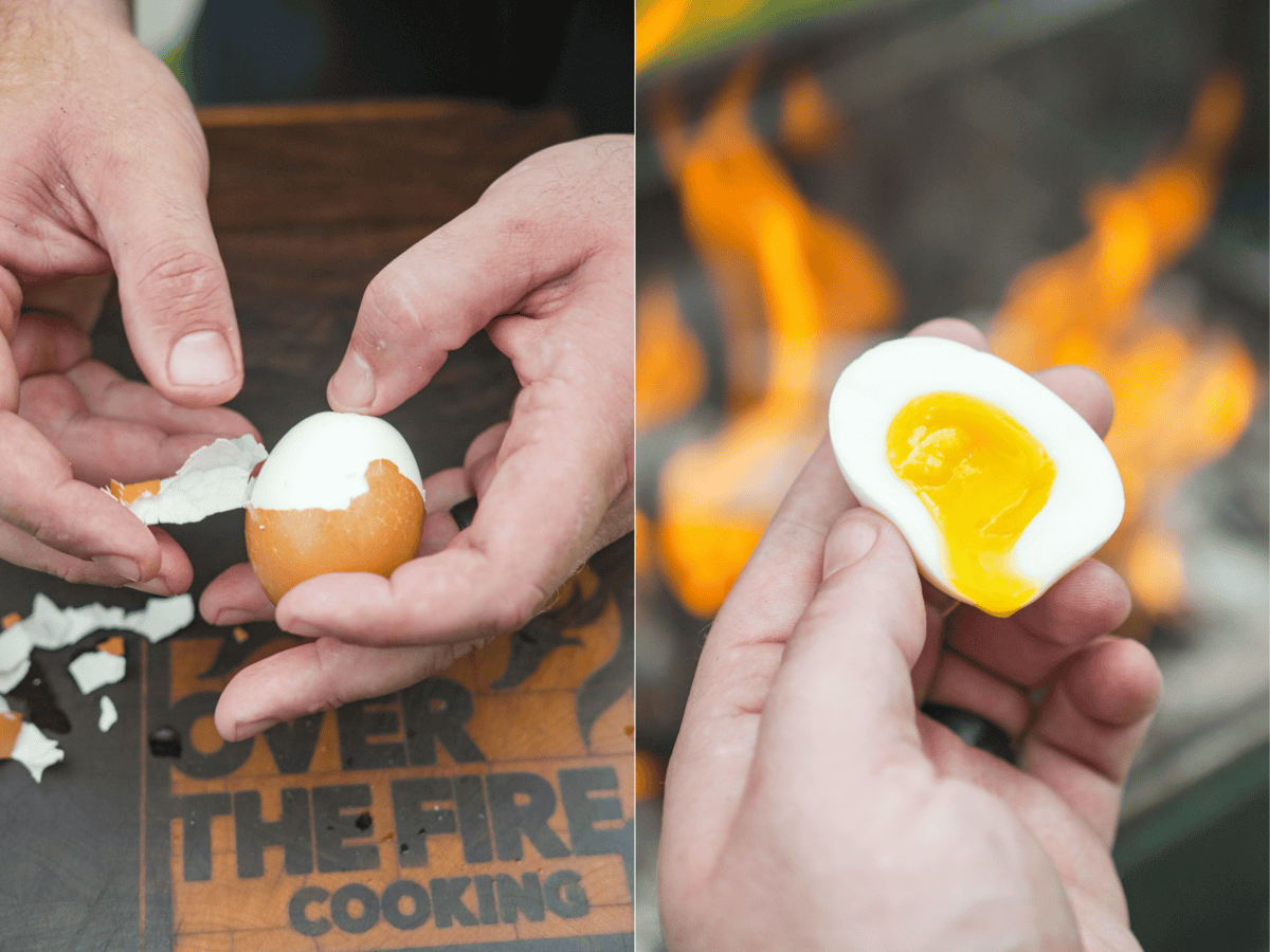 Peeling soft boiled eggs and holding up the sliced egg in front of the grill