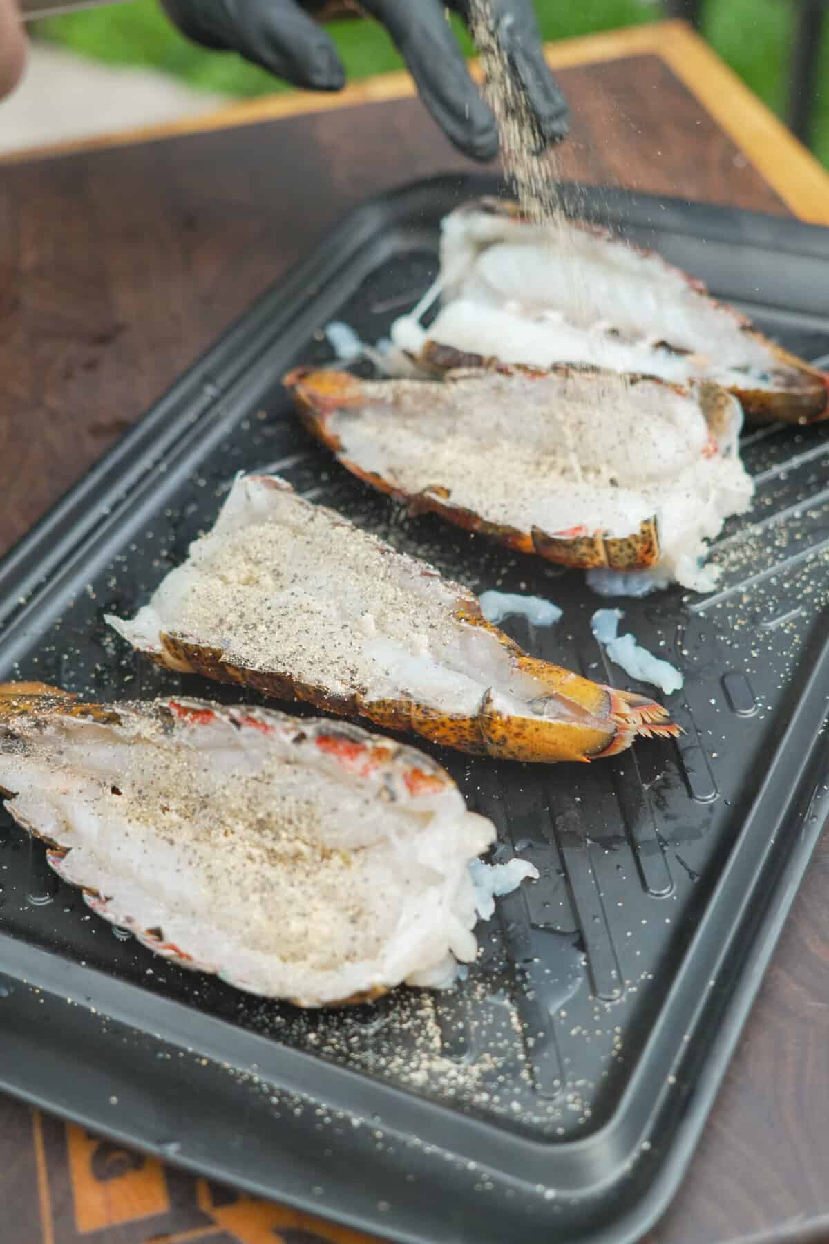 The lobster is prepped for the grill. Get ready for a buttery bite!