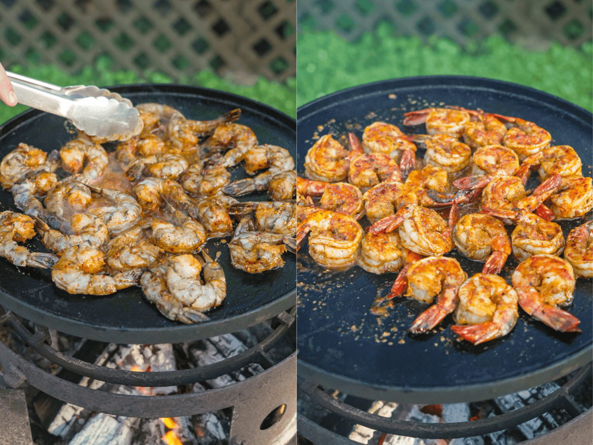 Grilling seasoned shrimp with tongs on an open fire skillet on the grill