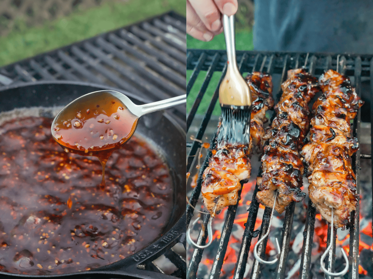 Teriyaki sauce simmering in a pot on the grill, with a spoon showing the texture of the sauce, and a hand using a grill brush to baste the grilled chicken skewers with the sauce
