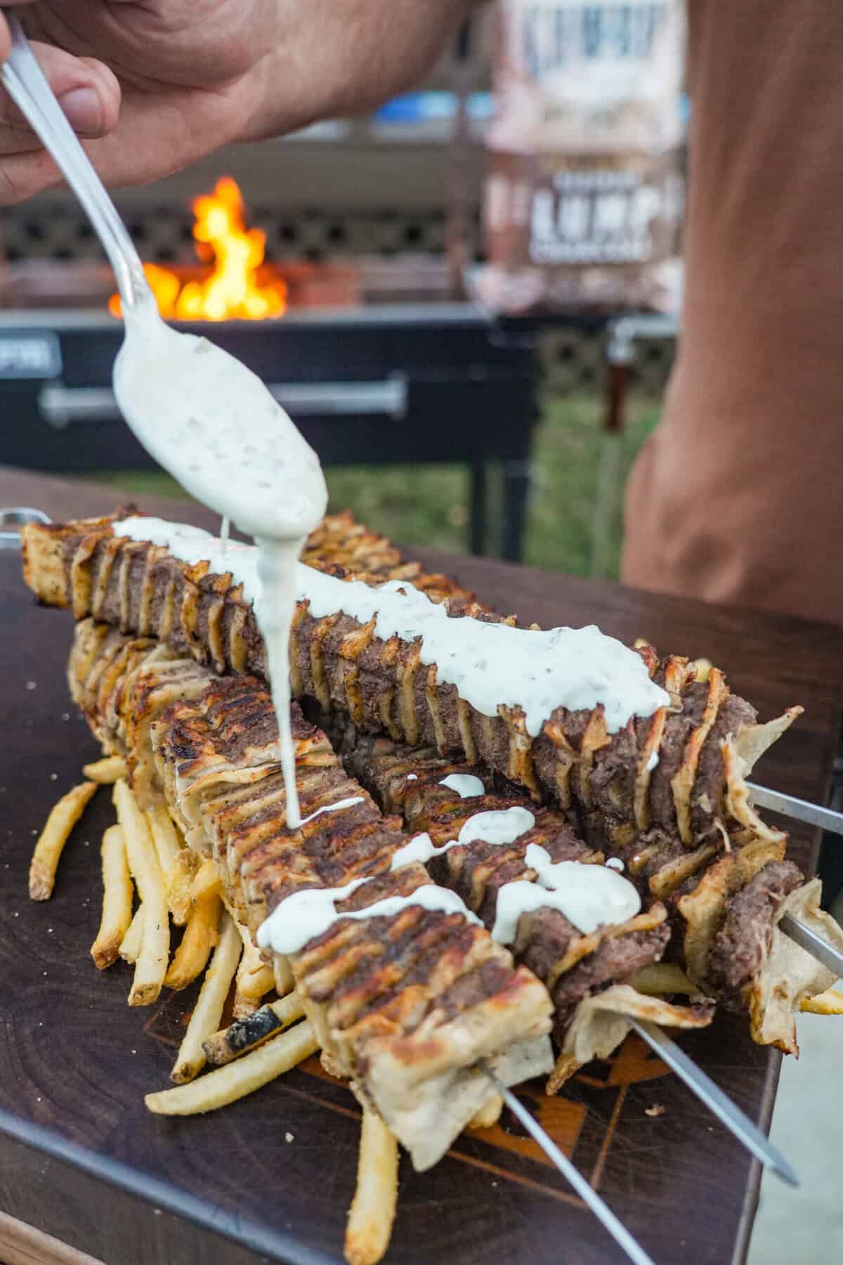 The creamy jalapeno sauce is drizzled over each tasty tortilla kebab.