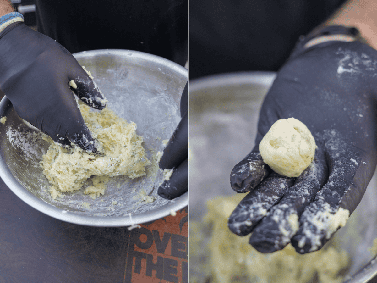 Gloved hands taking the potato croquette mixture and forming it into balls