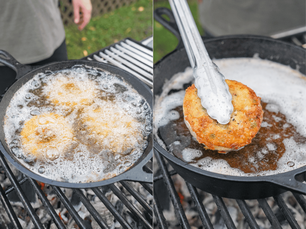 The onions are fried in a cast iron skillet. One is pulled out of the frying oil after reaching a golden brown color.