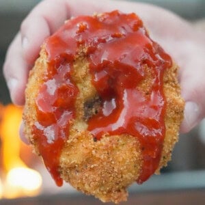 The Thanksgiving Onion Ring is dipped in a fire sauce before digging in.