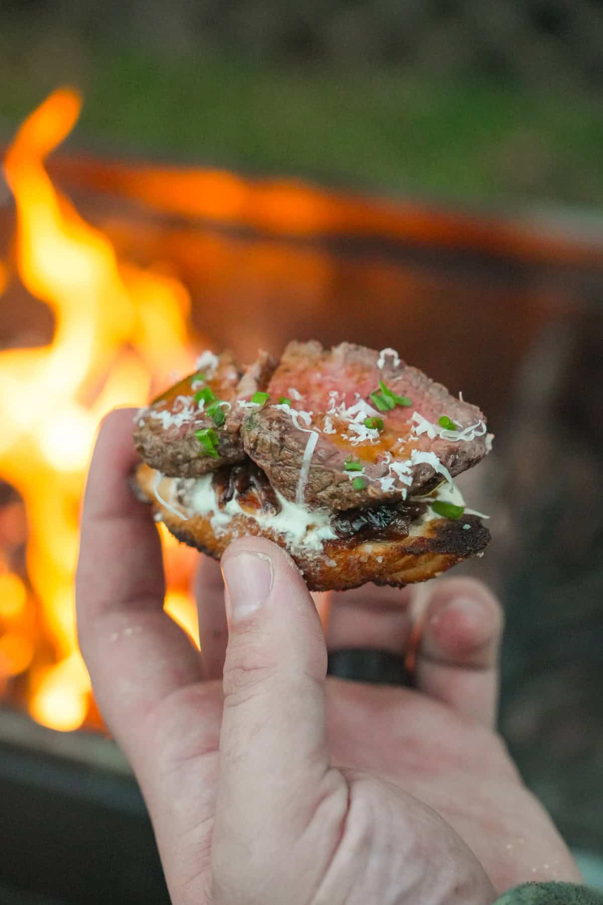Taking a bite of the insanely delicious steak crostini.