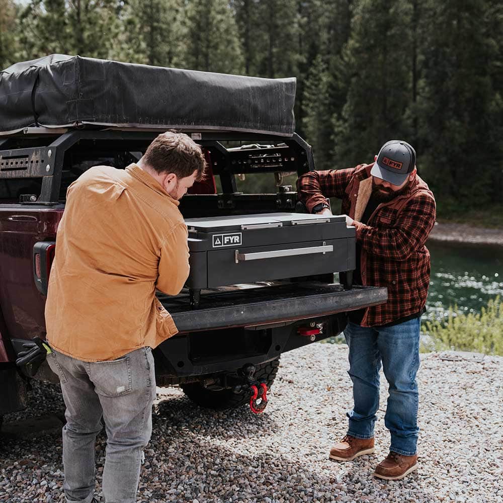 Two guys out in nature getting ready to cook a feast!