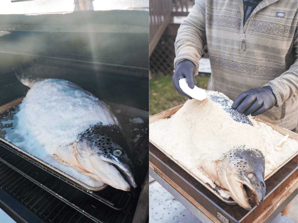 The giant salmon is buried in the salt mixture before hitting the smoker.