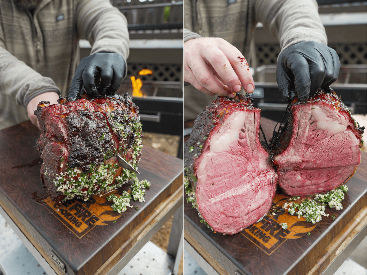 Derek Wolf slicing the hot honey smoked prime rib on a cutting board, then separating the pieces to show the inside of the finished product