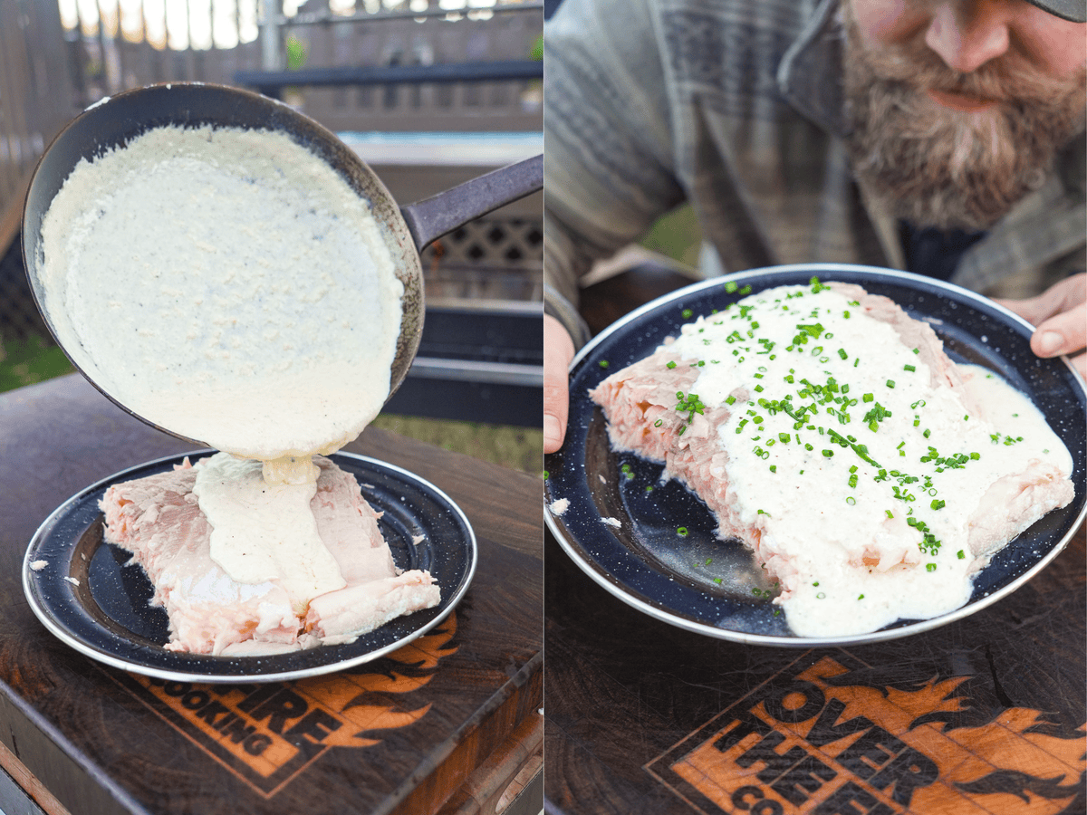 The incredible salmon is topped with the cream sauce and presented on a plate.