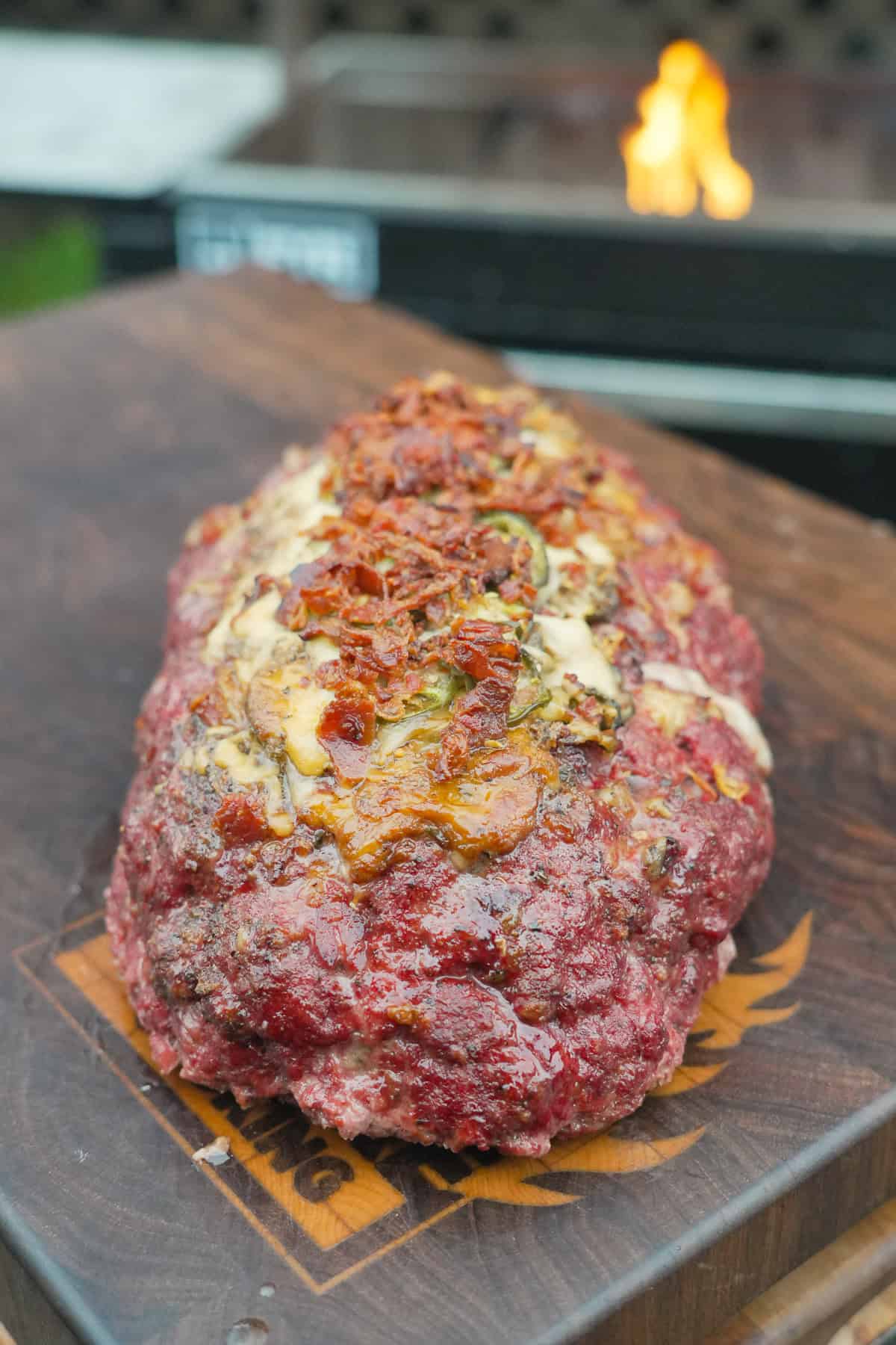 A whole log of Texas Twinkie meatloaf with cheese, jalape&ntilde;os, bacon bits and brisket on top