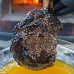 The Butter Steak is cooked to perfection, dipped in melted butter, and ready to slice.