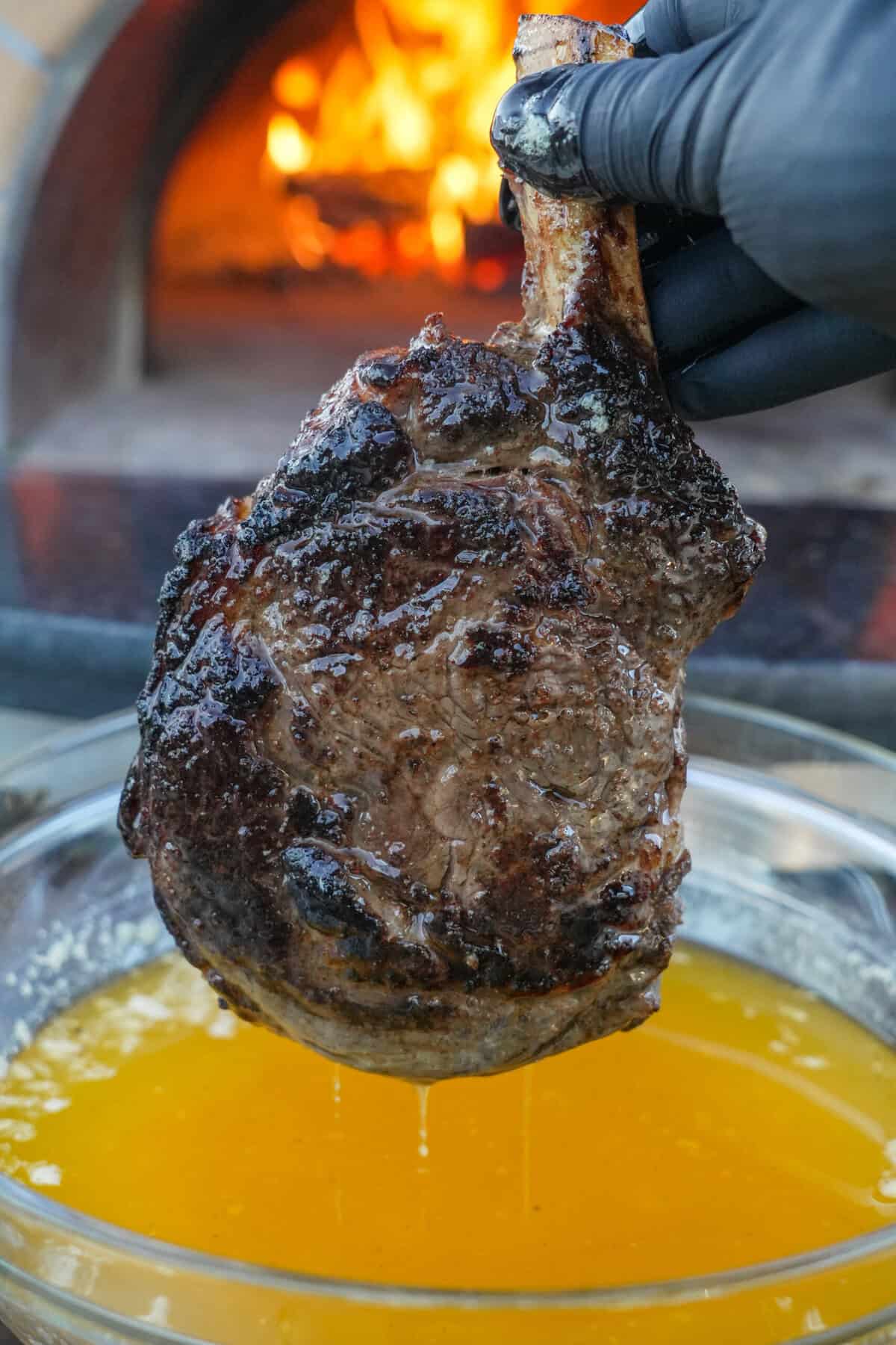 The Butter Steak is cooked to perfection, dipped in melted butter, and ready to slice.