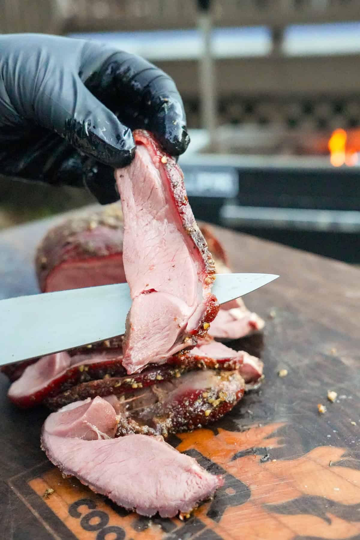 The perfectly cooked meat is sliced and ready to eat.