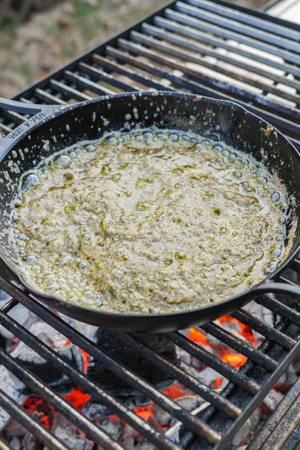 The flavor blasted steak sauce, put back on the grill so that we can "break" it. 