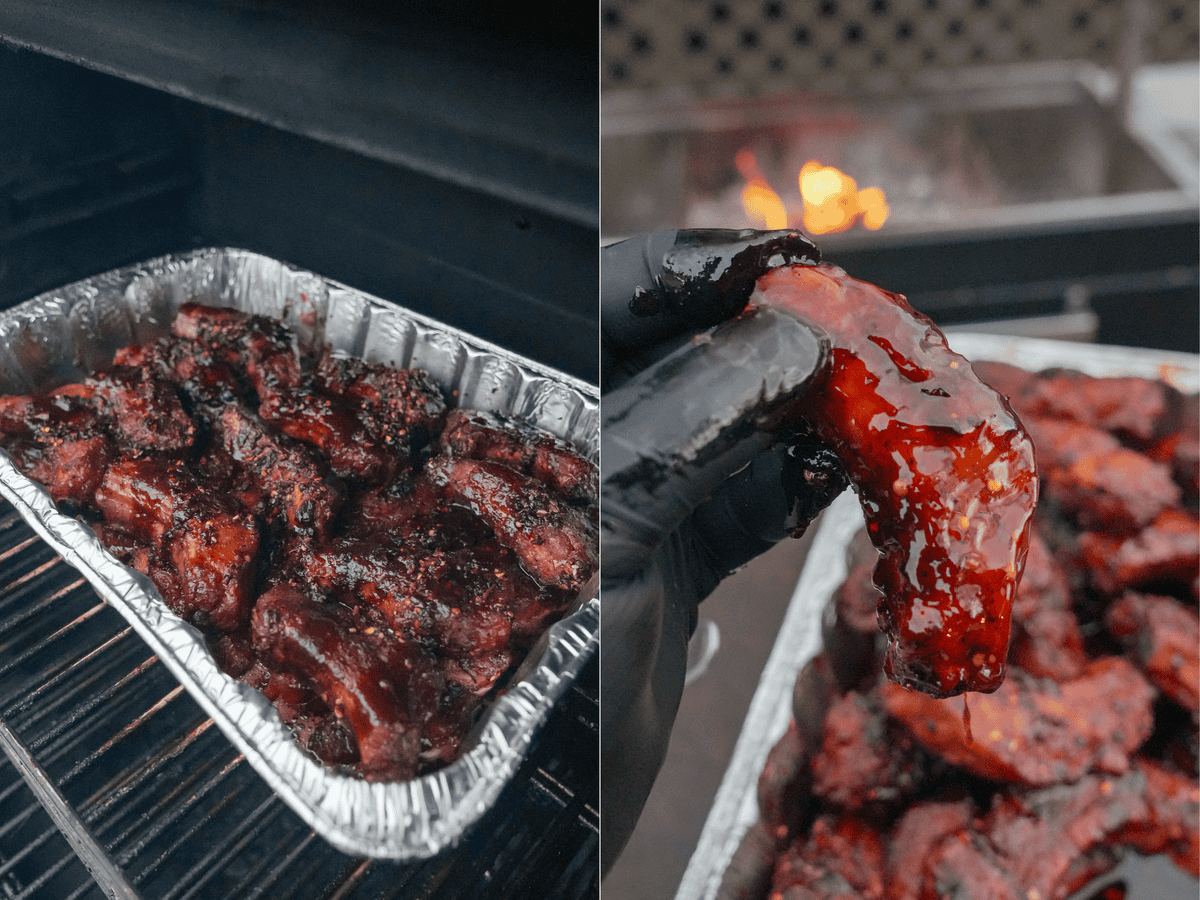 Ribs in the crutch on the smoker during the second half of the cook, and Derek Wolf's holding up an individual party rib to show the texture of the glaze