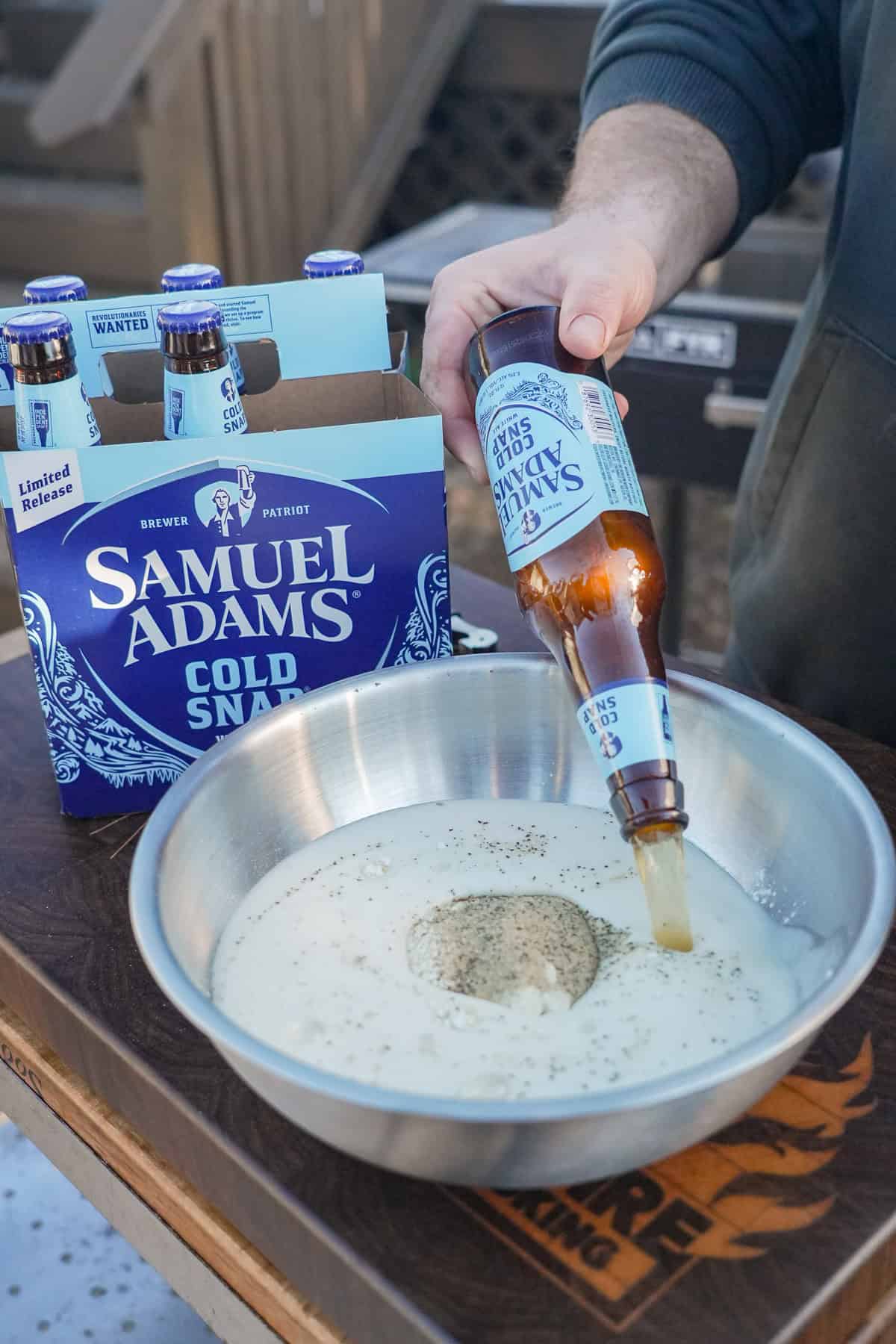 The beer batter is prepared for the poppers.