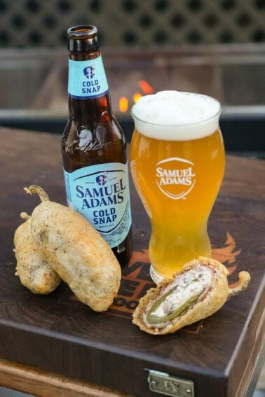 A tall glass of Samuel Adams Cold Snap is served with our tasty sliced deep fried jalapeno popper