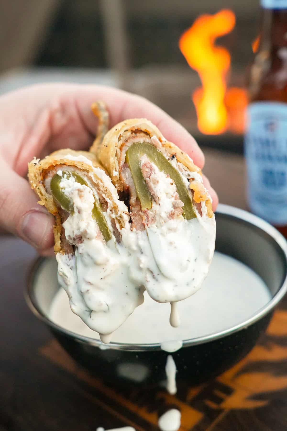 A view of the Beer Battered Texas Twinkies, sliced in half, and dipped in Ranch dressing.