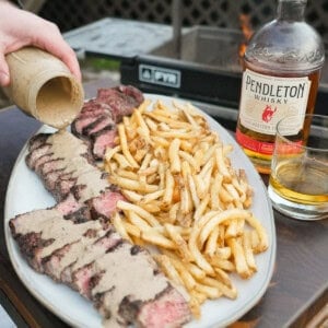 Steak au Poivre is an epic dish with perfectly cooked filets and crispy french fries and a creamy peppercorn sauce.