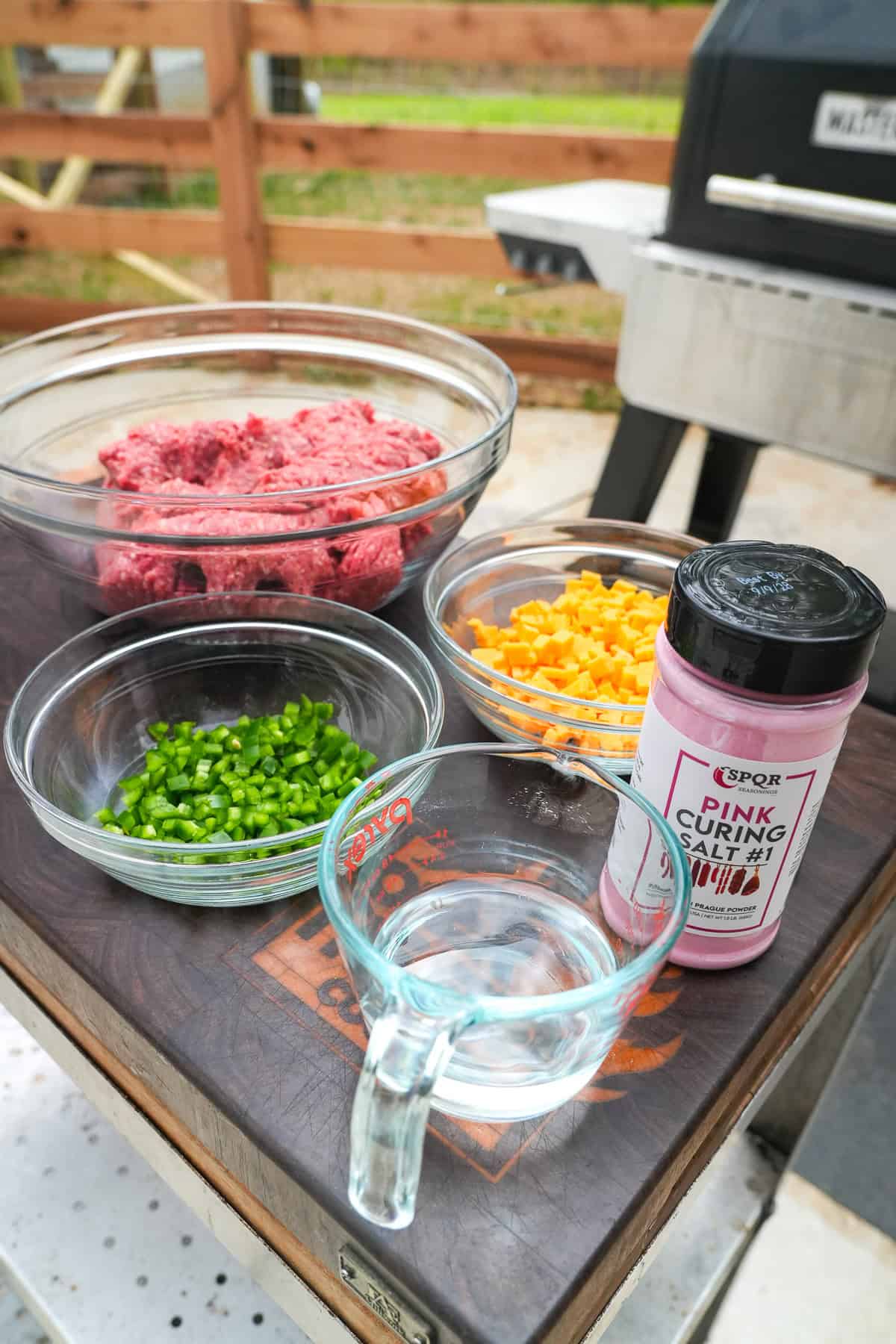 smoked beef stick ingredients on a cutting board