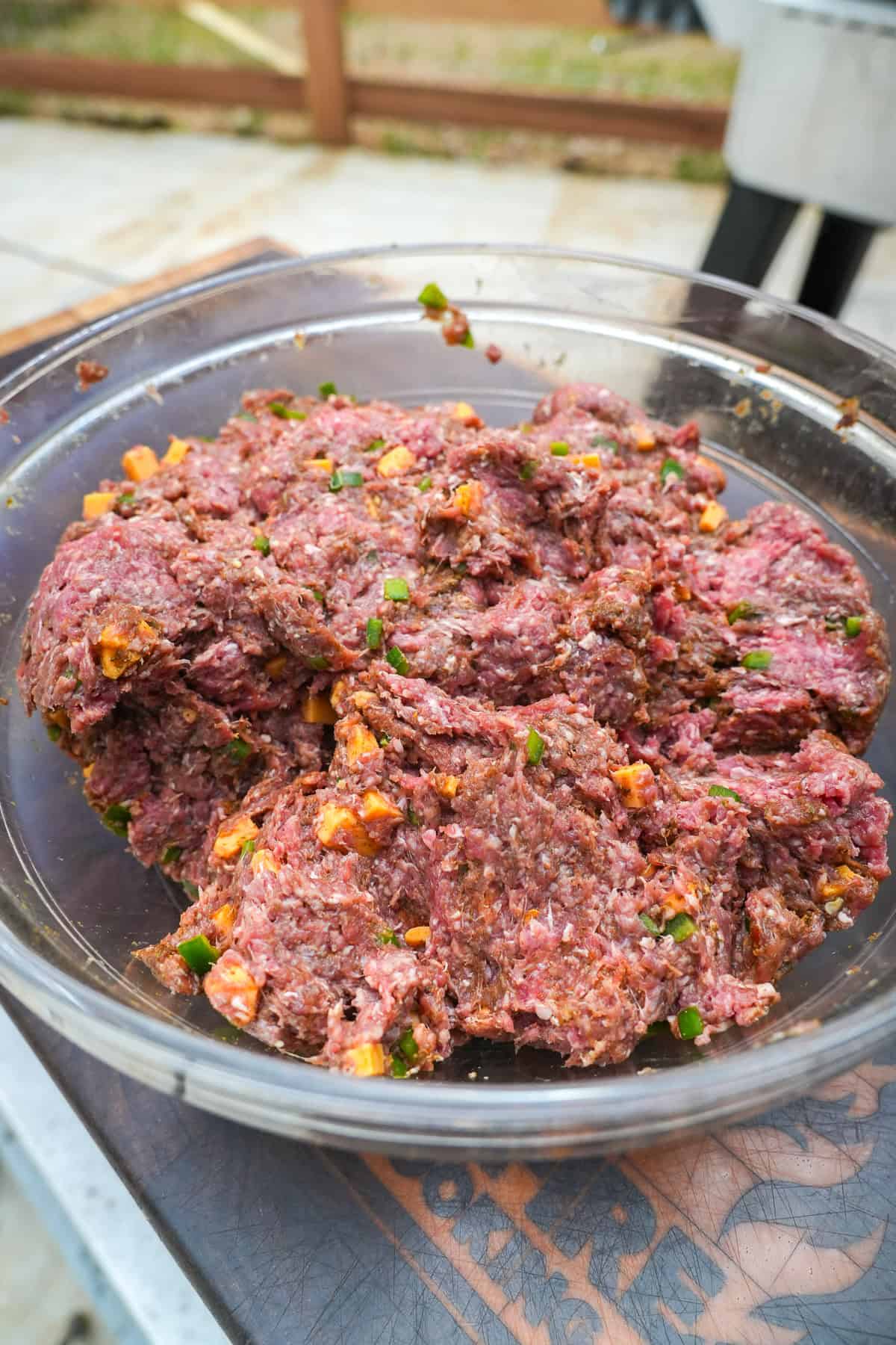 Mixed ground beef with cheese and peppers.