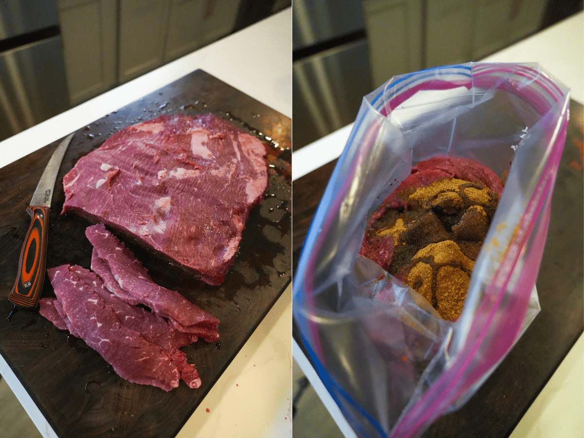 Slicing semi-frozen brisket on a cutting board, then placing in a plastic bag to marinate